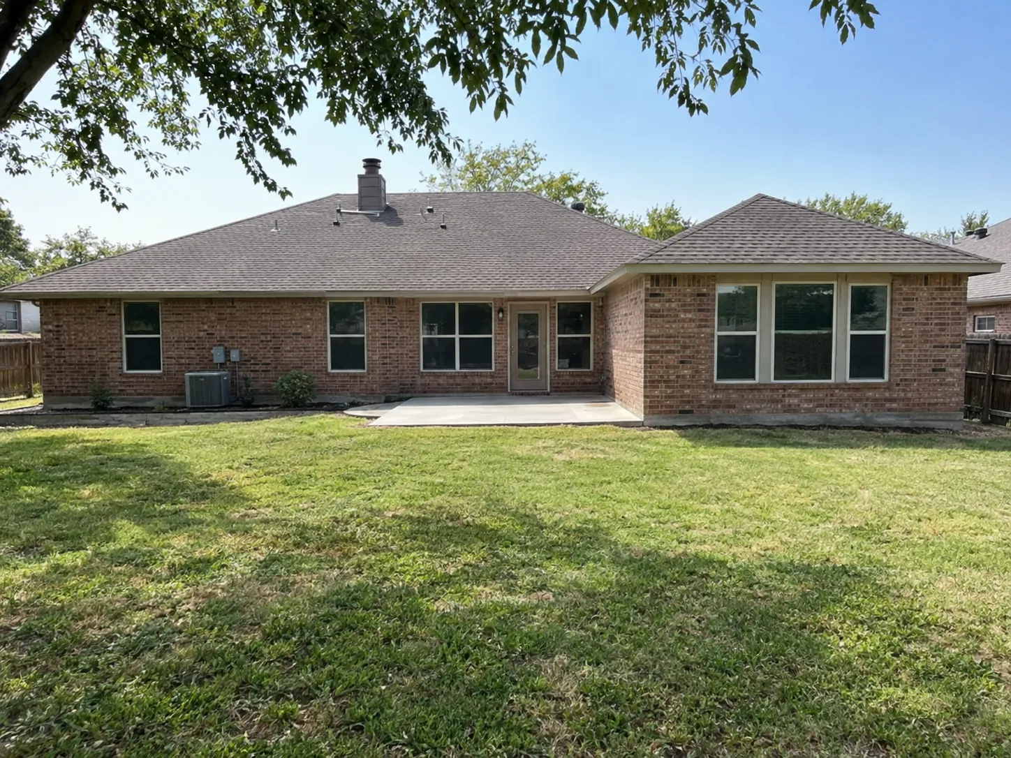 Brick home with a matched rear room addition